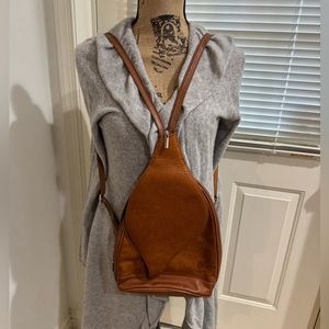 Florence chestnut leather camelback backpack. Made in Italy